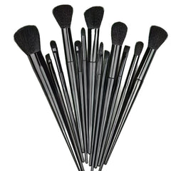 A 12-piece makeup brush set with black bristles and glossy black handles, arranged in a fan shape against a plain white background.