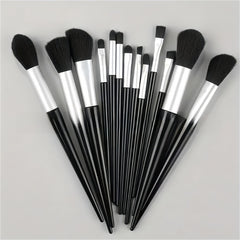 A 10-piece makeup brush set with black bristles, silver ferrules, and black handles, arranged in a fan shape on a light gray background.