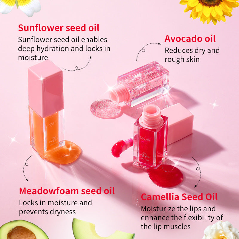 Four lip care bottles and dropper bottles arranged on a pink background with text callouts for sunflower seed oil, avocado oil, meadowfoam seed oil, and camellia seed oil. The bottles are pink and clear, showing orange, pink, and red liquids inside.