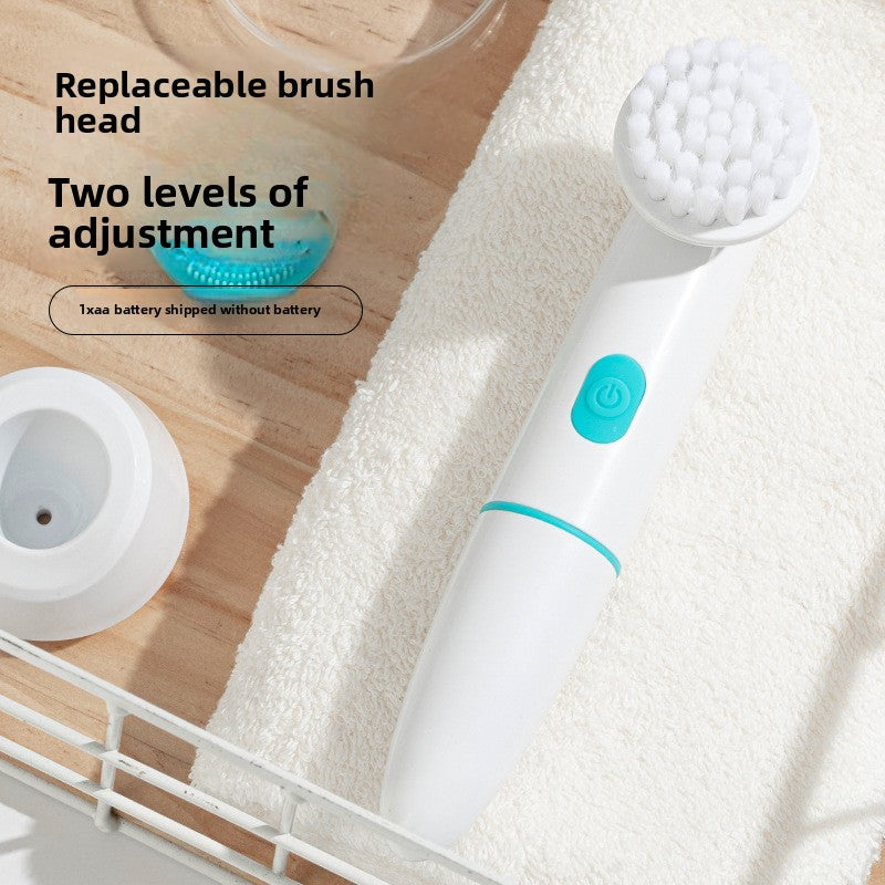 White and blue electric brush with replaceable brush head on a wooden surface with towel.