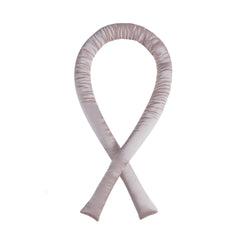 Pink ribbon-shaped object on a white background