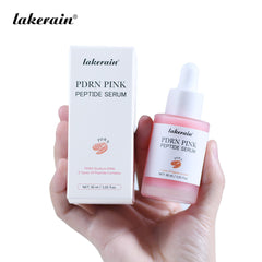 Lakerain PDRN Pink Peptide Serum packaging held in a hand against a white background