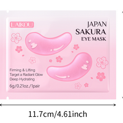 Pink LAIKOU Japan Sakura Eye Mask packaging with two pink eye-shaped gel illustrations and cherry blossom graphics, shown on a white background with a dimension marker reading 11.7cm/4.