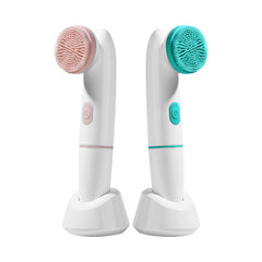 Two facial cleansing brushes with pink and green bristle heads on a white background
