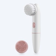 White and pink facial cleansing brush with two brush heads on a light gray background